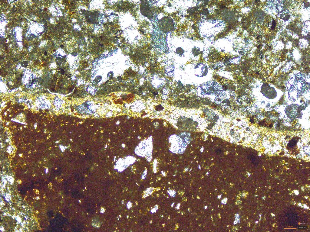 Ceramic fragment with clay coating on the surface (PPL)